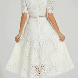 Irina – Midi suknelė su nėriniais ir išpjovimais" can be rewritten as "Irina – Midi Dress with Lace and Cut-Outs.