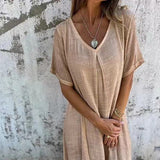Emilia – Laisva Midi Suknelė" can be rewritten as "Emilia – Relaxed Midi Dress.