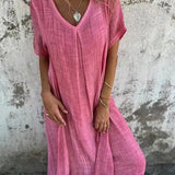 Emilia – Laisva Midi Suknelė" can be rewritten as "Emilia – Relaxed Midi Dress.