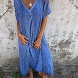 Emilia – Laisva Midi Suknelė" can be rewritten as "Emilia – Relaxed Midi Dress.