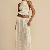 Florina – Viršus su plisuota nugarėle" could be rewritten as "Florina – Top with Pleated Back Detail.
