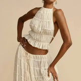 Florina – Viršus su plisuota nugarėle" could be rewritten as "Florina – Top with Pleated Back Detail.