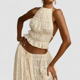 Florina – Viršus su plisuota nugarėle" could be rewritten as "Florina – Top with Pleated Back Detail.
