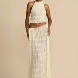 Florina – Viršus su plisuota nugarėle" could be rewritten as "Florina – Top with Pleated Back Detail.