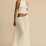 Florina – Viršus su plisuota nugarėle" could be rewritten as "Florina – Top with Pleated Back Detail.
